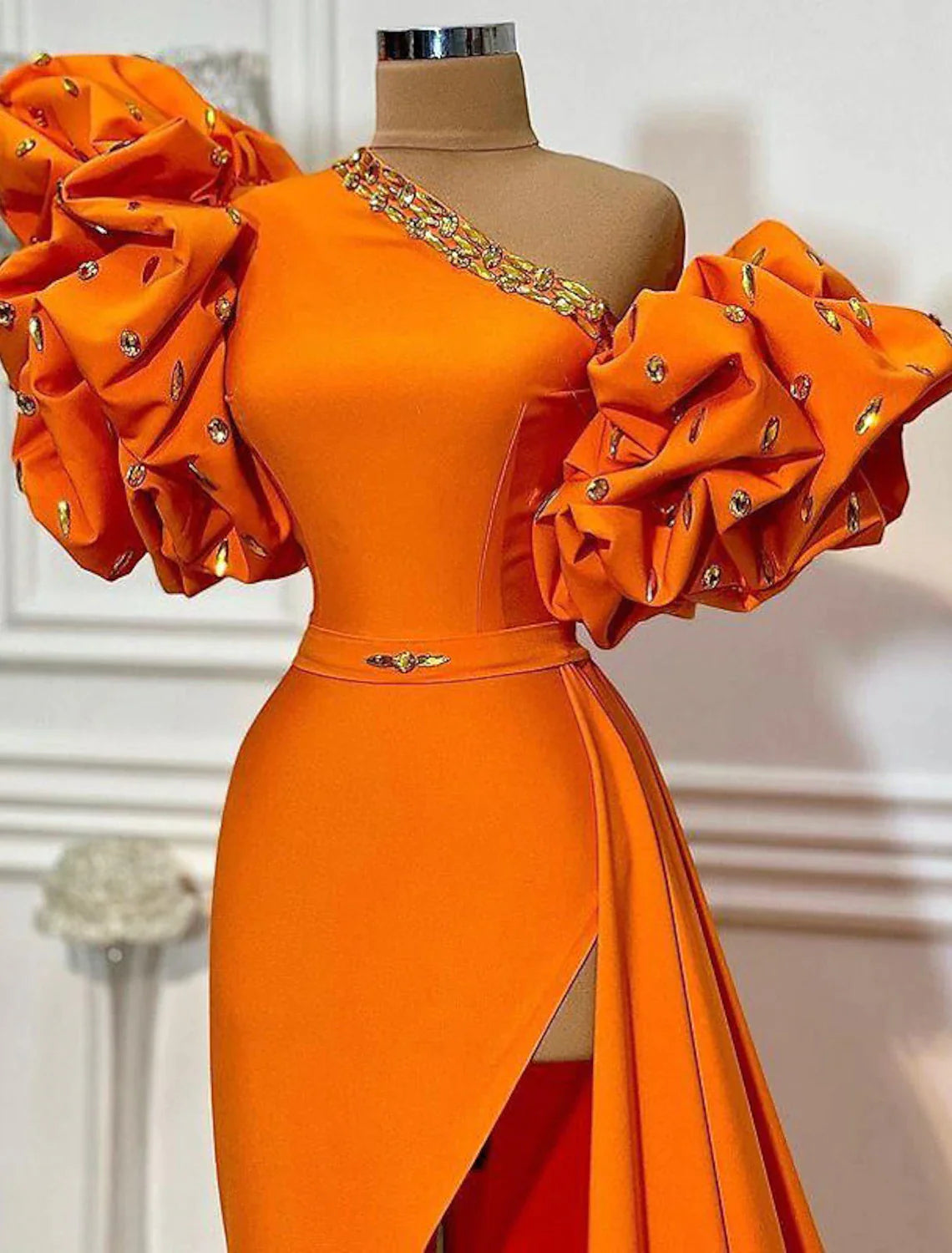 Side view of the A-line one-shoulder floral satin evening gown, highlighting the short sleeve and leg slit.