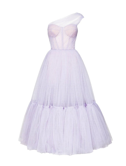 Detail of the pleated tulle fabric and one-shoulder neckline of the formal dress.