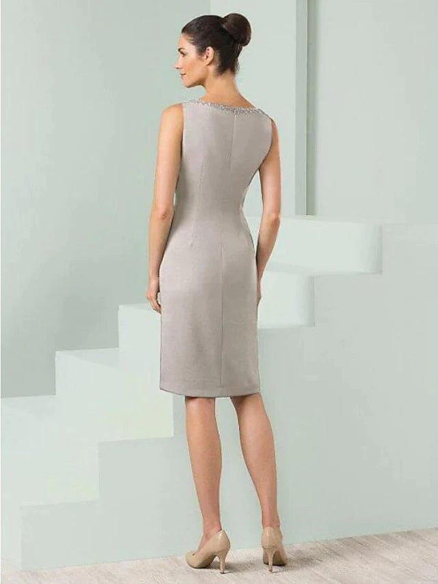 Back view of the knee-length satin Mother of the Bride dress, showing the half sleeves and included wrap.