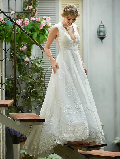 Detail of the plunging V-neckline with intricate lace appliques.
