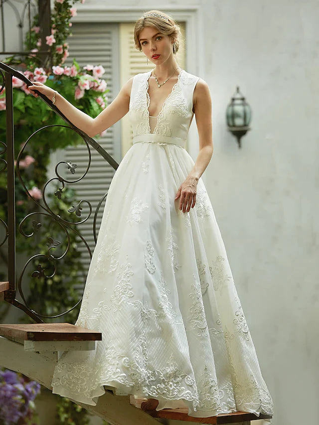 Full length view of the bridal gown, emphasizing the elegant drape of the tulle skirt.