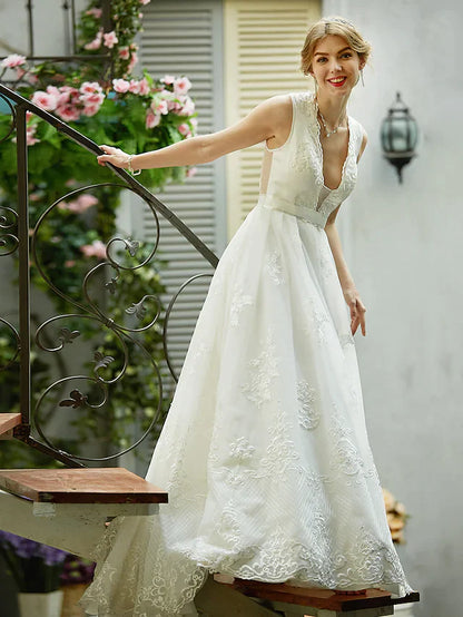 Front view of the A-line wedding dress, showing the full design and elegant flow.