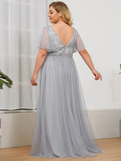 Close-up of the sequined bodice and tulle skirt of the A-line bridesmaid dress.