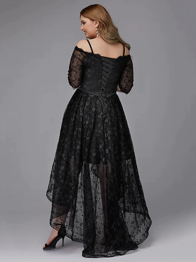 Close-up of the asymmetrical lace and pleats on the A-line dress.