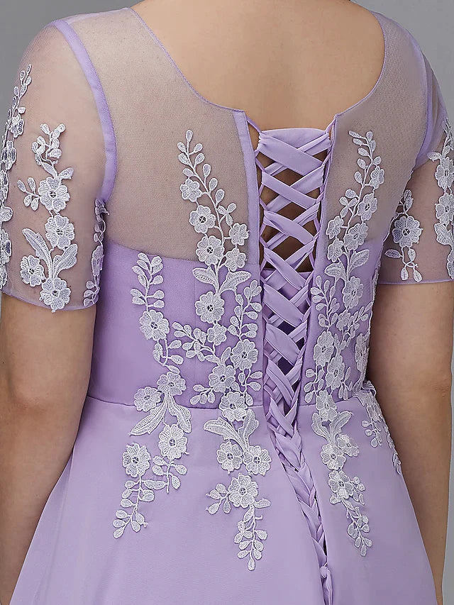 Close-up of the illusion neckline and short sleeve details on the plus size dress.