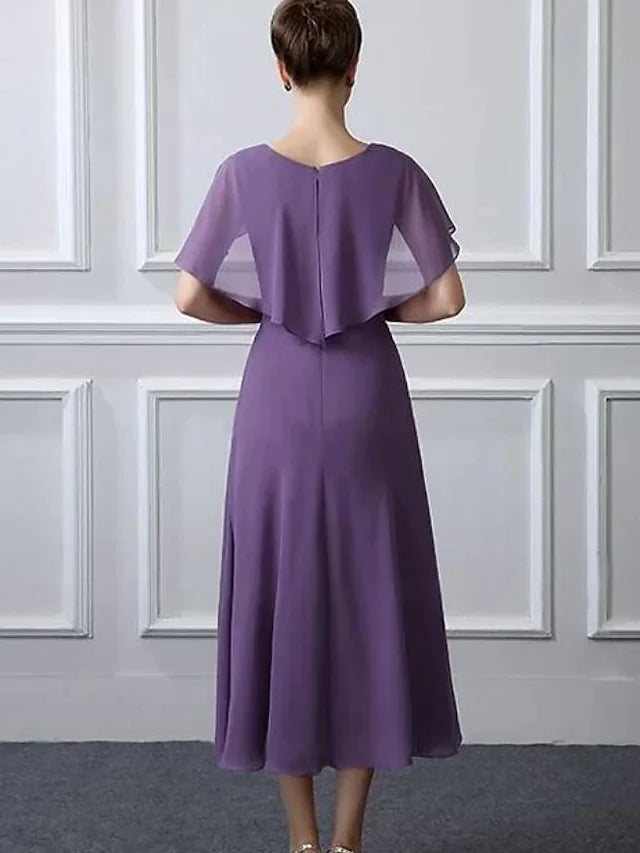 A-line plus size mother of the bride dress with tea length and chiffon fabric, side view.