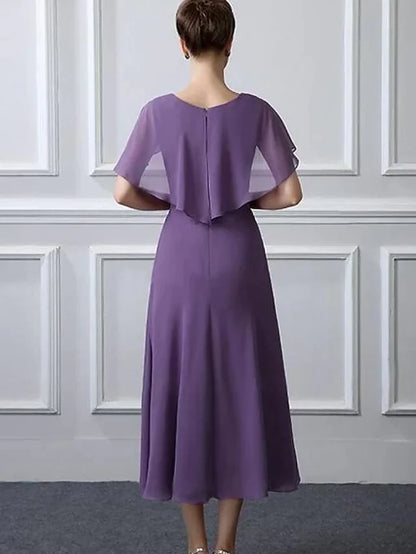A-line plus size mother of the bride dress with tea length and chiffon fabric, side view.