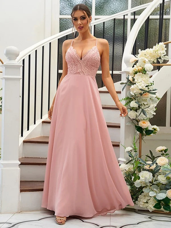 Woman wearing an elegant A-Line chiffon and lace V-neck bridesmaid dress.