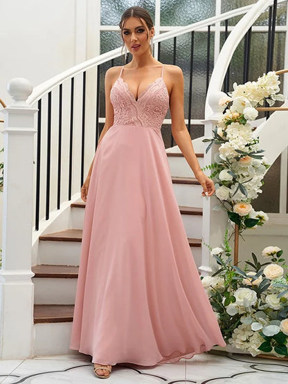 Woman wearing an elegant A-Line chiffon and lace V-neck bridesmaid dress.