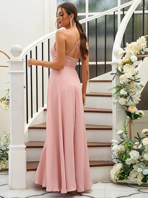 Back view of a woman in a sleeveless floor-length A-Line bridesmaid dress.