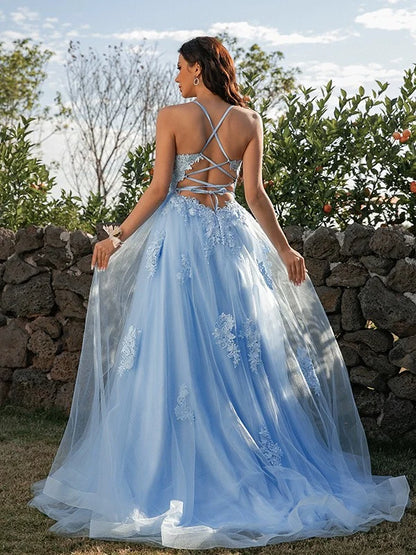 Back view of a model in a beautiful A-Line tulle prom dress with halter neckline.