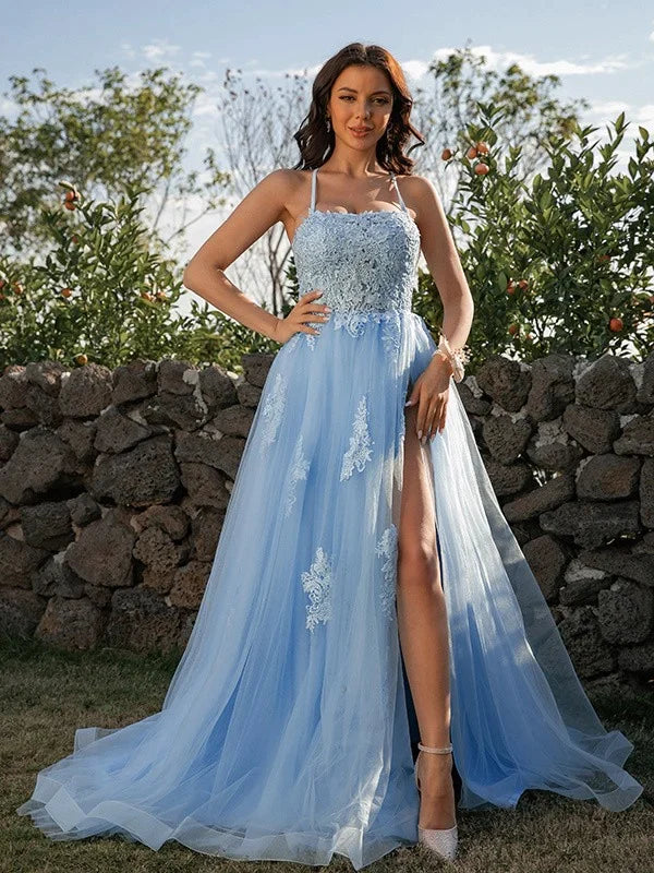 Full view of a model posing in a stunning A-Line princess prom gown.