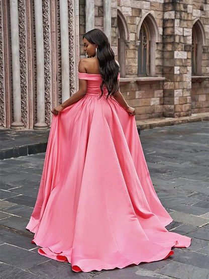 Side view of A-Line satin prom dress showing court train and ruffled neckline.