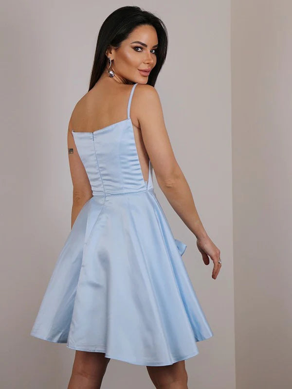 Side view of a woman in the A-line mini dress, highlighting the satin bowknot detail.