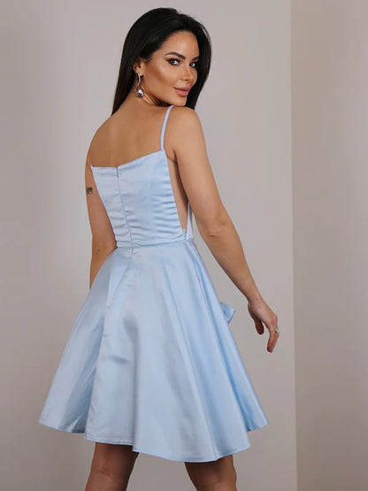 Side view of a woman in the A-line mini dress, highlighting the satin bowknot detail.
