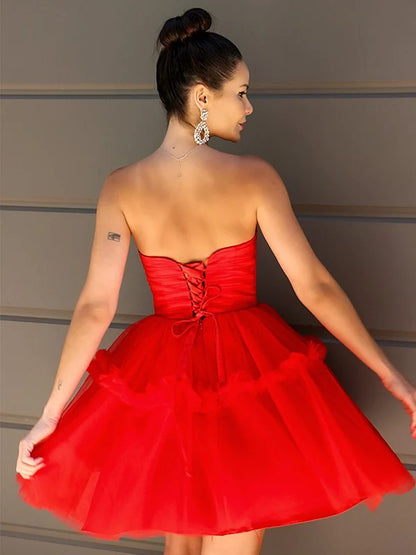Side view of a sky blue A-Line Princess homecoming dress, highlighting delicate tulle ruffles.