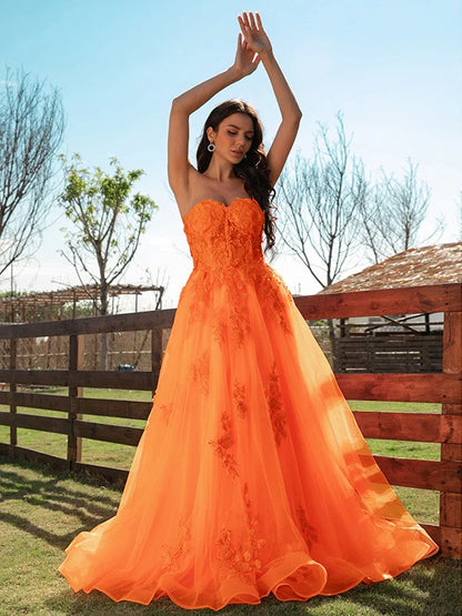 Side view of A-Line princess tulle applique sweetheart sleeveless floor-length prom dress.