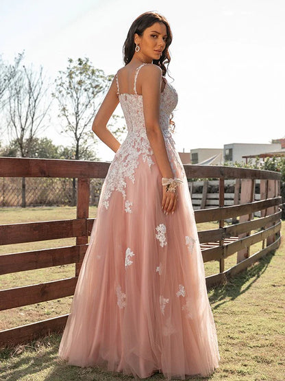 Sleeveless A-Line Tulle Prom Gown with intricate appliques, side view.