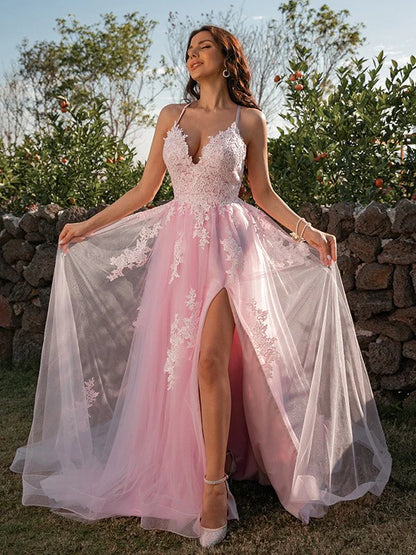 Full view of an elegant pink A-line prom dress with V-neck and delicate applique details.