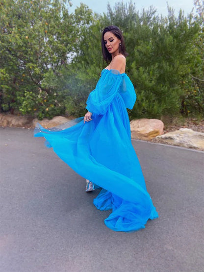 Back view of the A-line princess tulle dress with long sleeves and delicate beading.