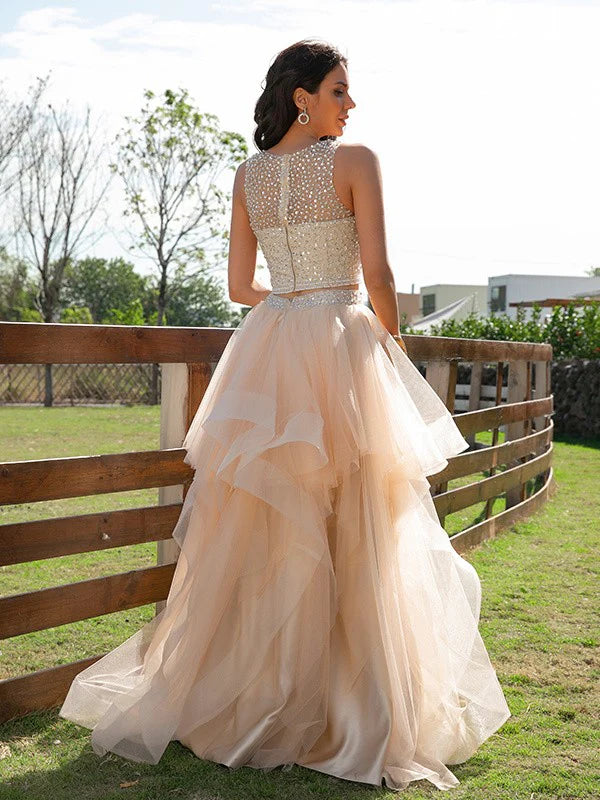 Close-up of the beaded bodice and scoop neckline of the two-piece formal dress.