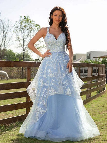 Model wearing an elegant A-line princess tulle lace V-neck floor-length prom dress.