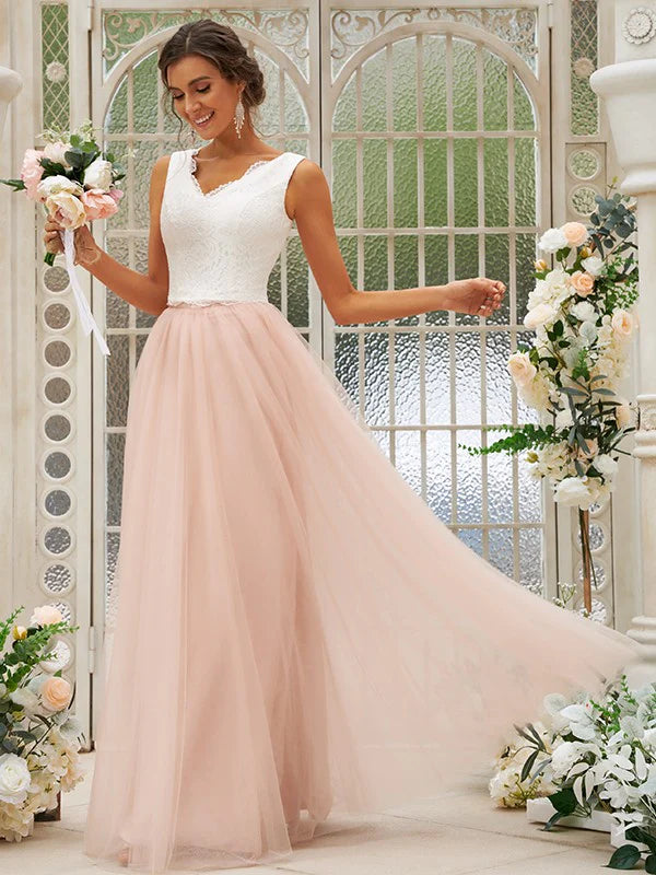 Woman in an elegant A-line tulle lace V-neck bridesmaid dress.
