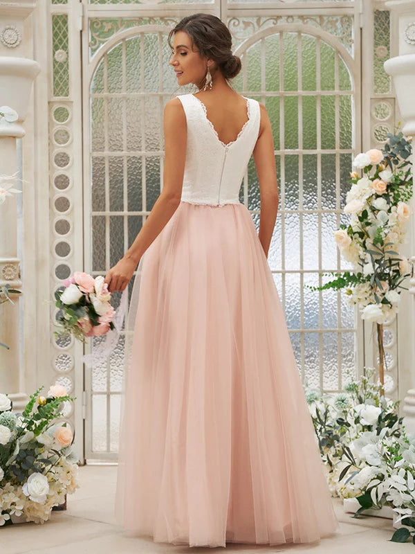 Back view of a woman wearing a floor-length V-neck bridesmaid gown.