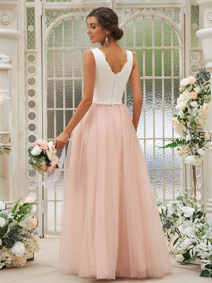 Back view of a woman wearing a floor-length V-neck bridesmaid gown.