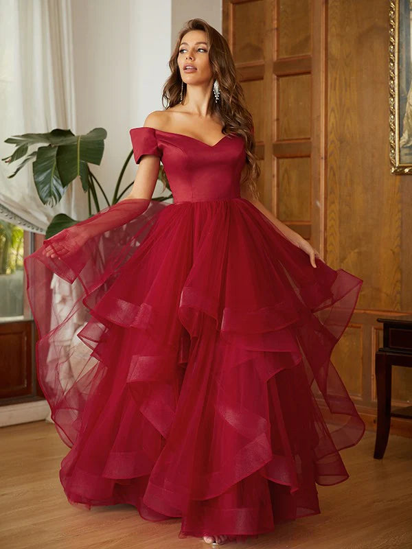 Elegant A-line princess tulle ruffle off-shoulder floor-length prom dress on a model, front view.