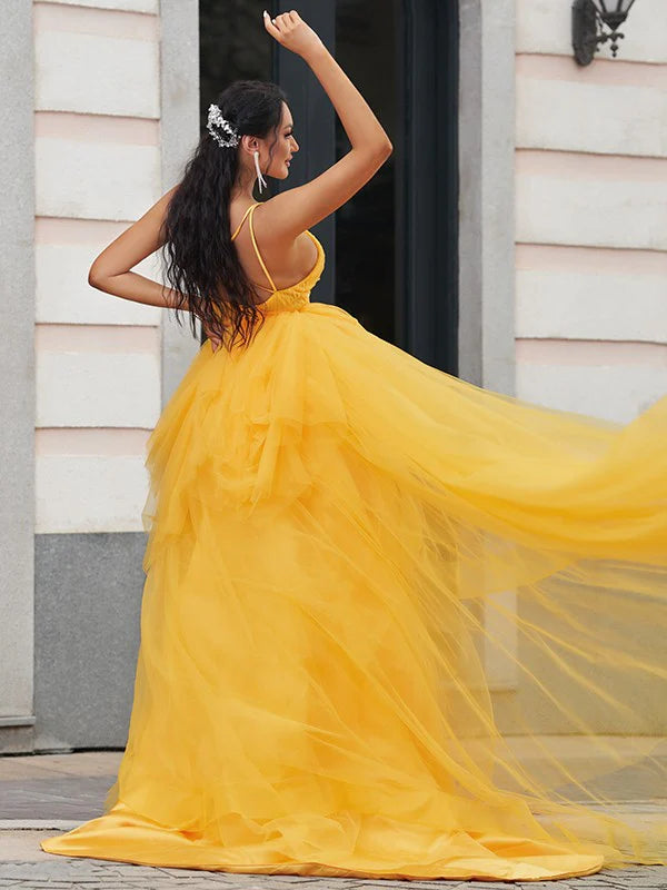 Back view of the light blue A-line prom dress, showcasing the asymmetrical hem.
