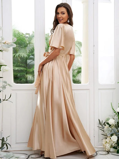 Model showcasing the flowy floor-length A-line bridesmaid dress with a V-neck.