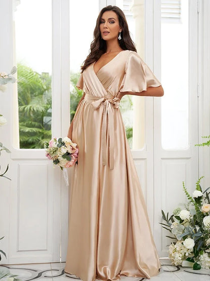 Side view of the A-line princess bridesmaid dress featuring short sleeves and a ribbon belt.