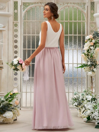 Close-up of the scoop neck and chiffon ruffles on the bridesmaid dress.