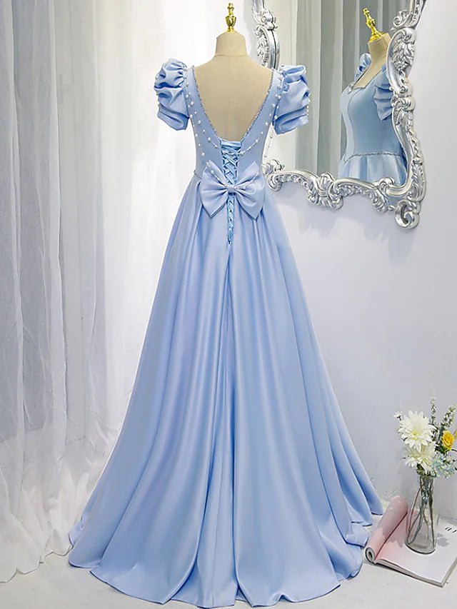 Back view of the A-line satin bridesmaid dress, showcasing the delicate bow and beading.