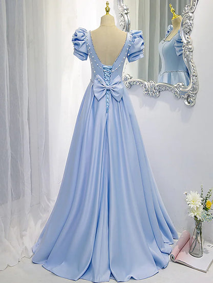 Back view of the A-line satin bridesmaid dress, showcasing the delicate bow and beading.