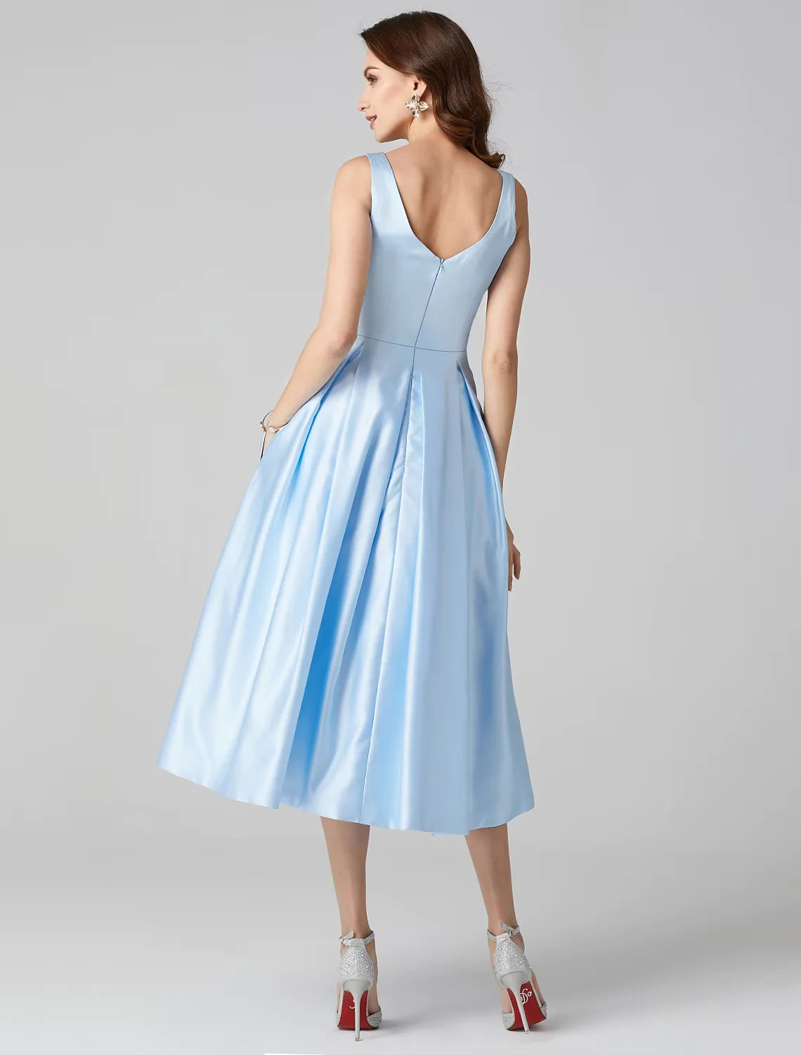 Back and side view of the A-Line satin tea-length dress, highlighting the pleats and silhouette.