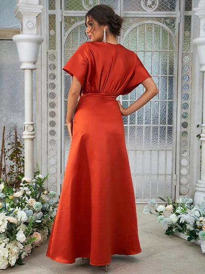 Back view of an A-Line satin ruched V-neck short sleeve floor-length bridesmaid dress.