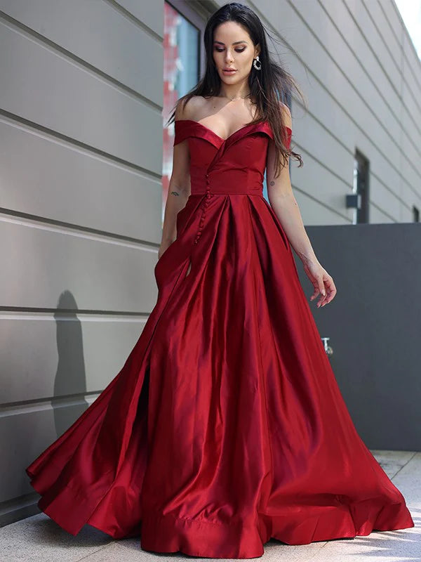 Close-up of the off-the-shoulder neckline and ruffle details on the satin dress.