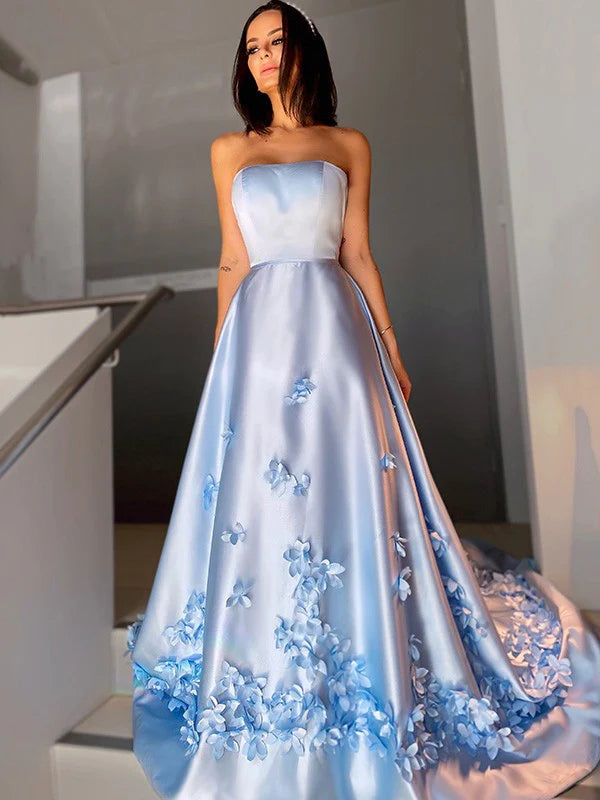 A-Line satin strapless prom dress with hand-made flowers, side view.