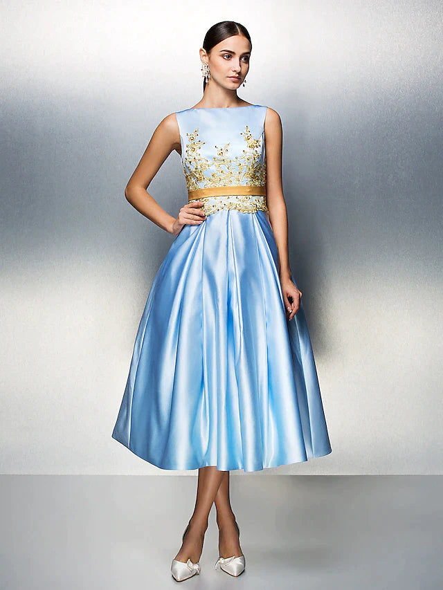 Woman in elegant A-line satin tea length dress with jewel neck.
