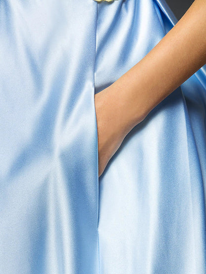 Full length view of the A-line satin tea length dress.