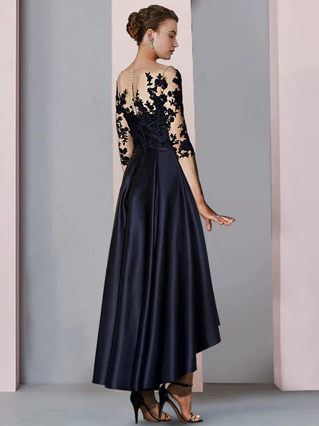 Back view of the A-line high-low tea length dress with 3/4 sleeves and lace appliques.
