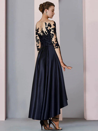 Back view of the A-line high-low tea length dress with 3/4 sleeves and lace appliques.