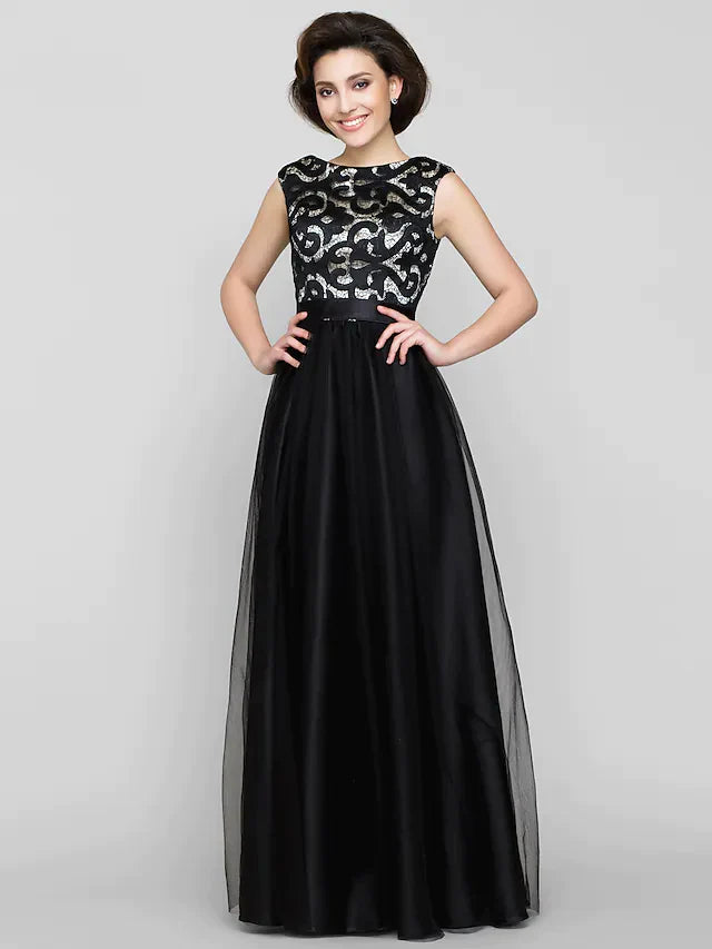 Woman wearing a patterned A-line mother of the bride dress.