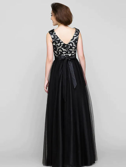 Side view of a woman in a patterned A-line mother of the bride dress.