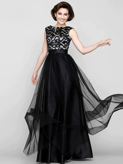 Back view of a woman in a patterned A-line mother of the bride dress.