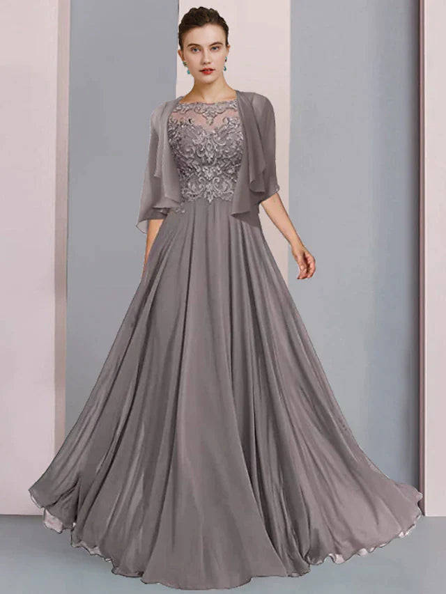 Woman in an elegant A-line mother of the bride dress with half sleeves and a scoop neck, front view.