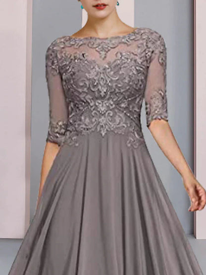 Woman in an elegant A-line mother of the bride dress with half sleeves and a scoop neck, back view.