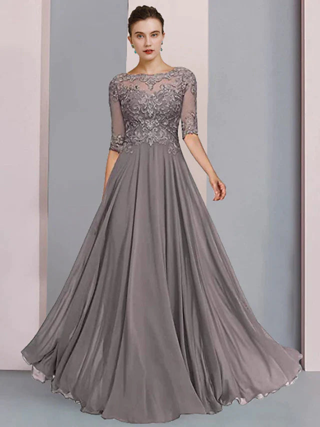 Close-up of the chiffon and lace details with pleats and beading on the elegant A-line dress.